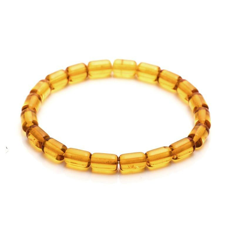 Bracciale in ambra cognac cilindrica — per custodire una luce antica