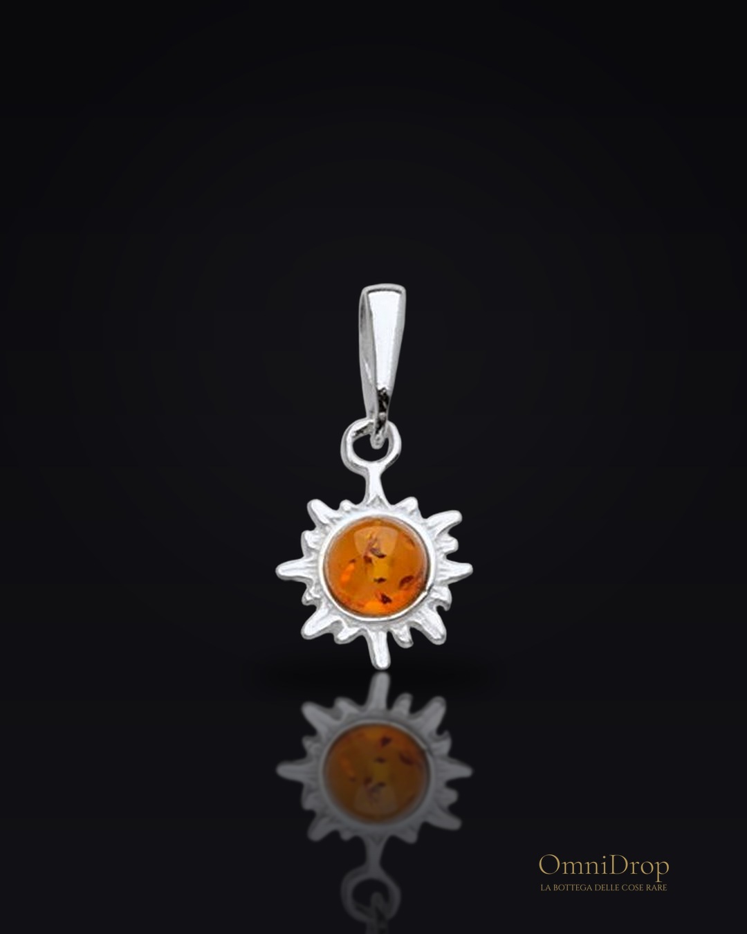 Ciondolo sole ambra cognac, luce del ricordo