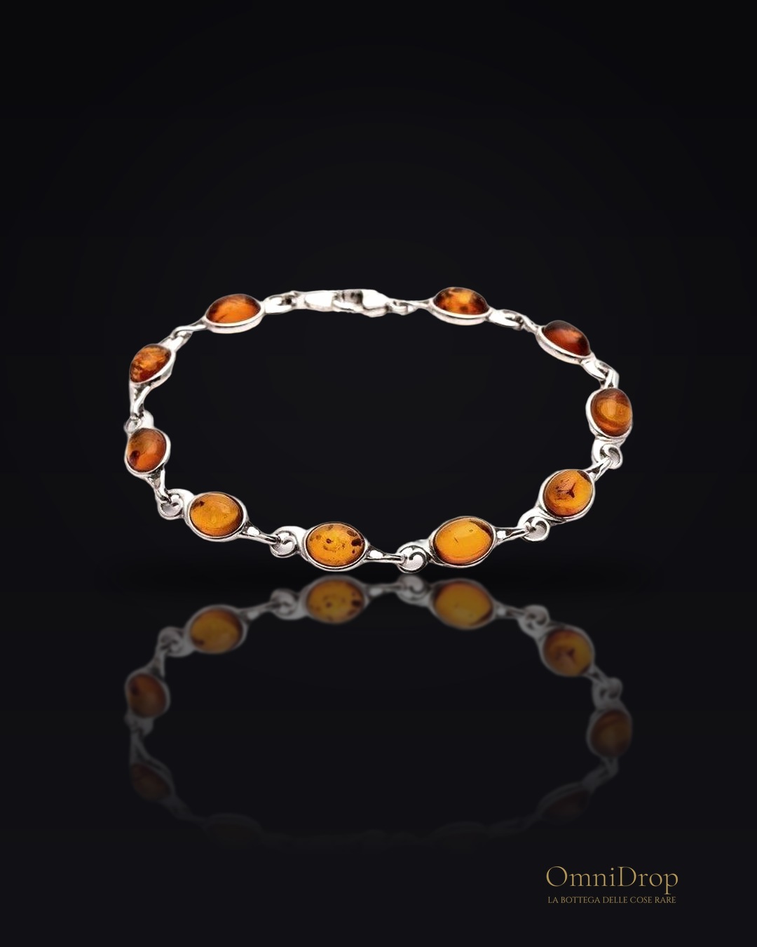 Bracciale in argento rodiato con ambra cognac ovale, per custodire la tua luce interiore