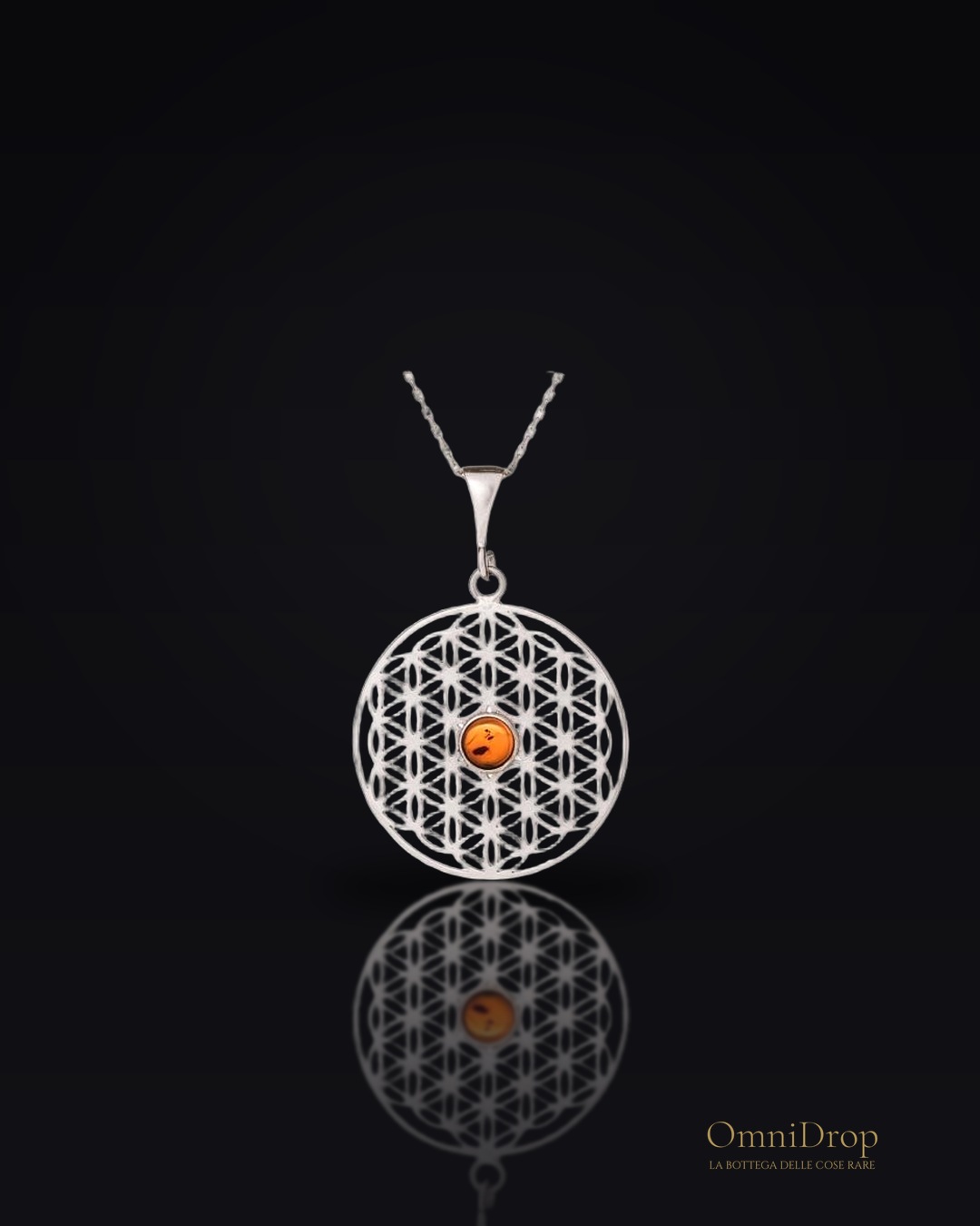 Ciondolo Fiore della Vita in argento e ambra cognac, per custodire l'armonia interiore