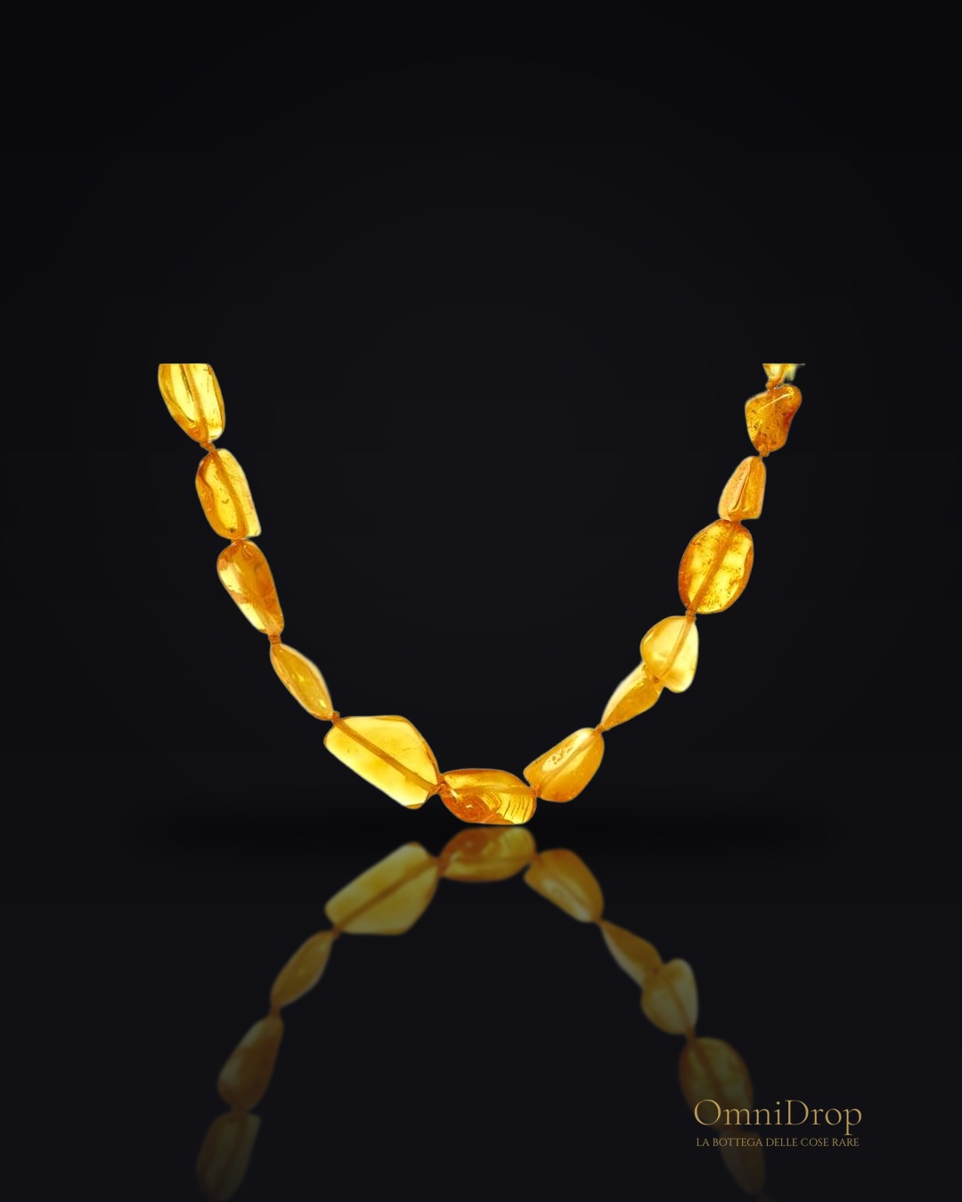 Collana in ambra baltica miele irregolare naturale, chiusura a vite, 70 cm